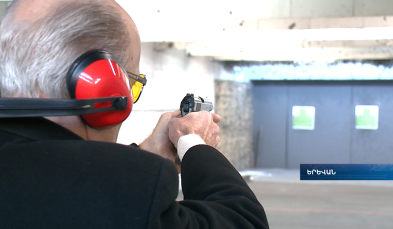 State officials compete at a shooting range