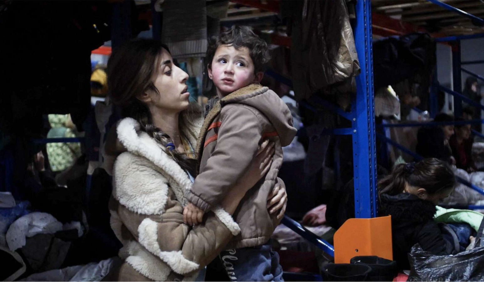 Migrants camped in Belarus warehouse wait for another chance as supplies running out