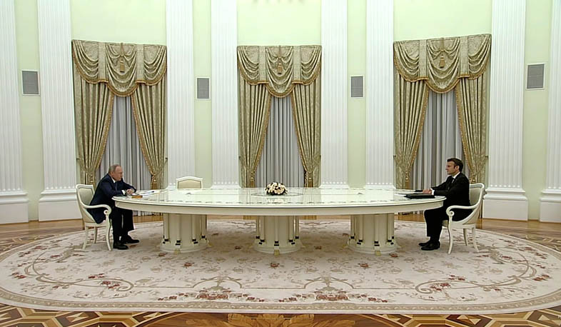 Putin and Macron begin talks at the Kremlin with taking coronavirus precautions