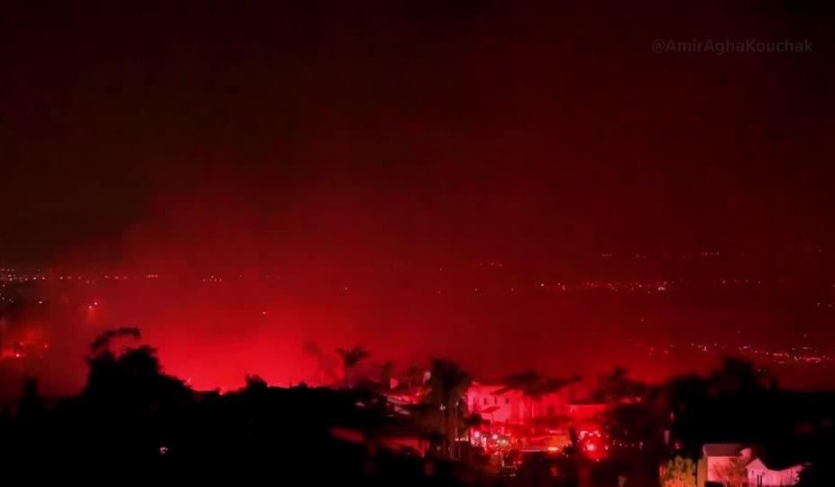 Raging wildfire lights night sky in California