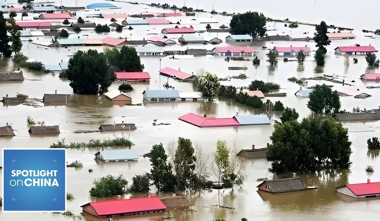 Firefighters rescue dozens of people trapped by flash flood in Guangxi