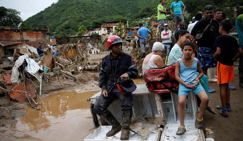 Venezuela floods kill 25 after month’s worth of rain falls in eight hours