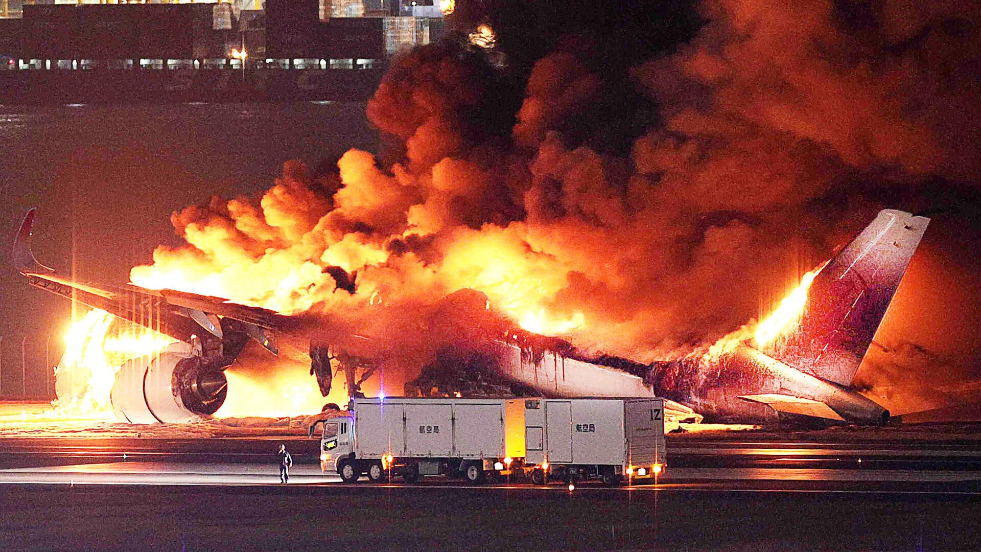 Travellers shocked by Japan plane fire, relieved passengers saved