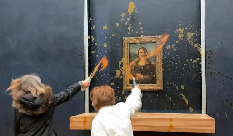 Climate change activists throw soup at Mona Lisa painting in Paris