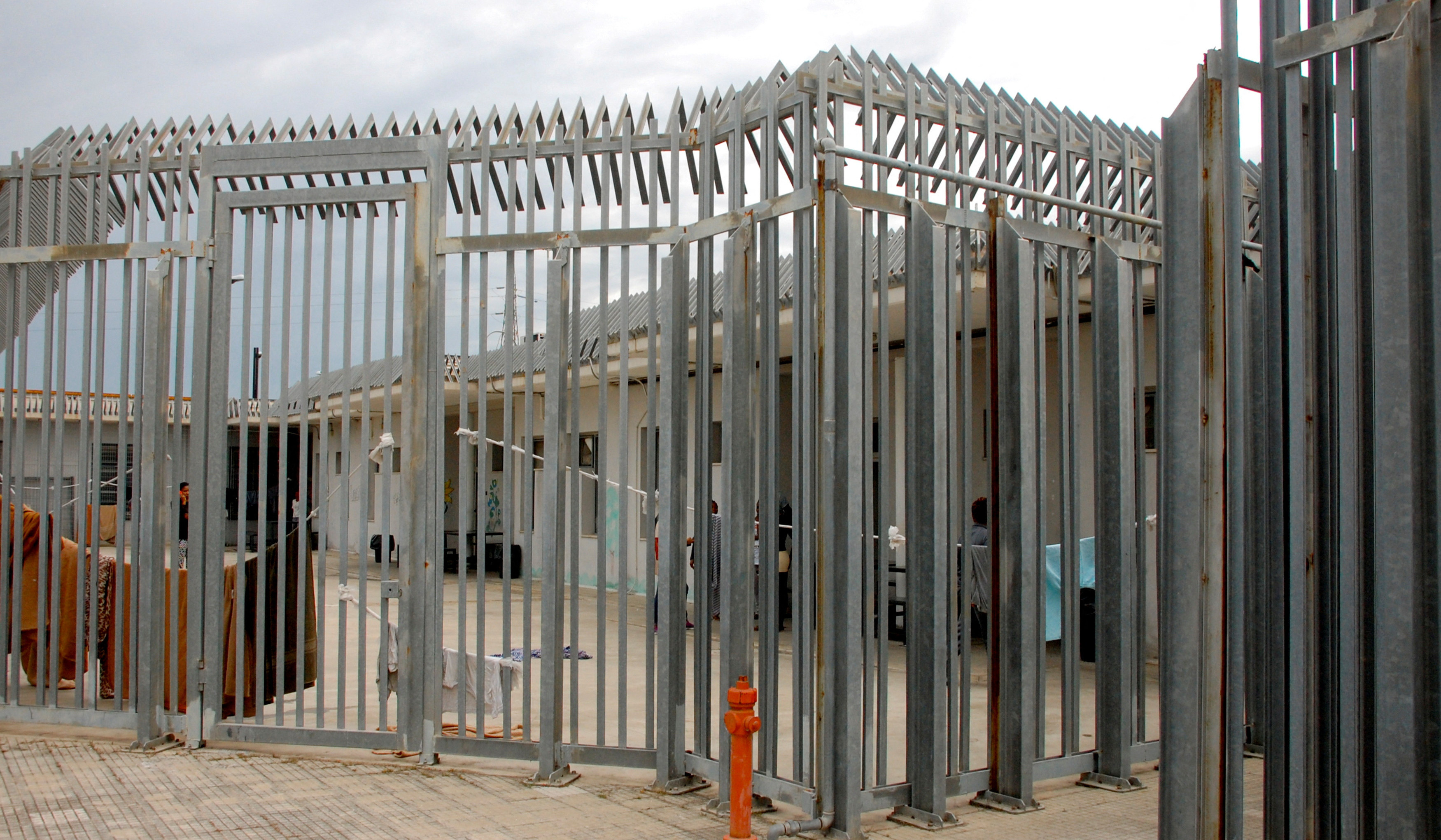 Italy arrests 14 after unrest at migrant detention centre