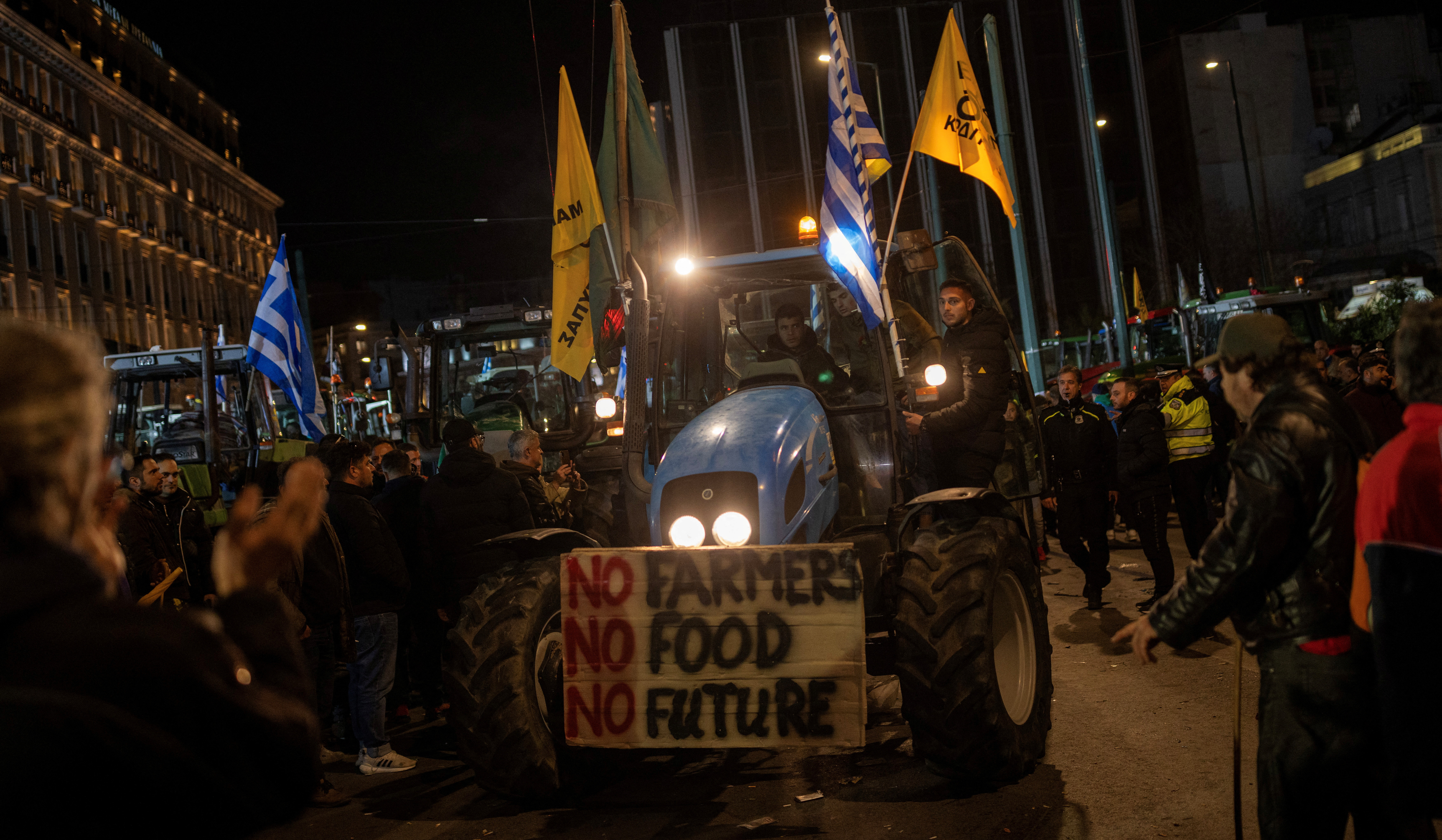 Greek farmers spend the night outside Athens parliament