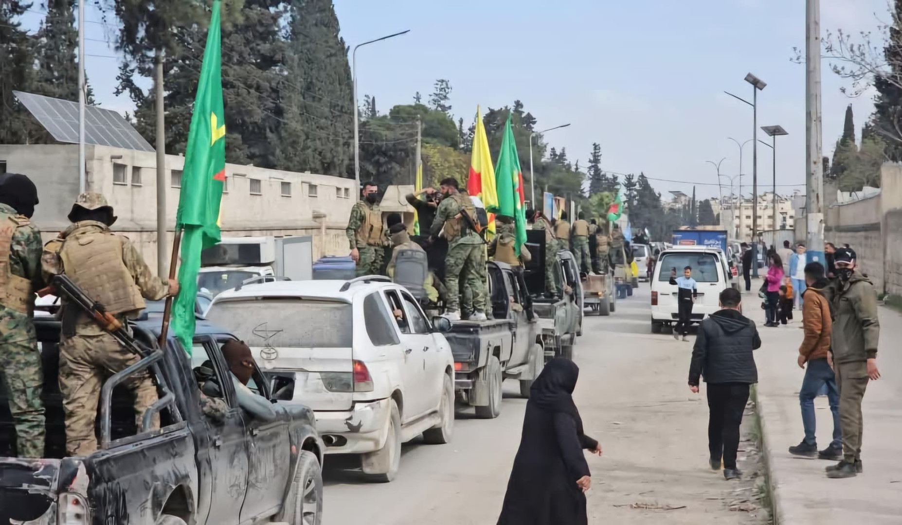 Kurdish fighters leave northern city in Syria as part of deal with central government