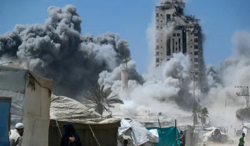 Israeli forces level high-rise building in Gaza City, defense minister says