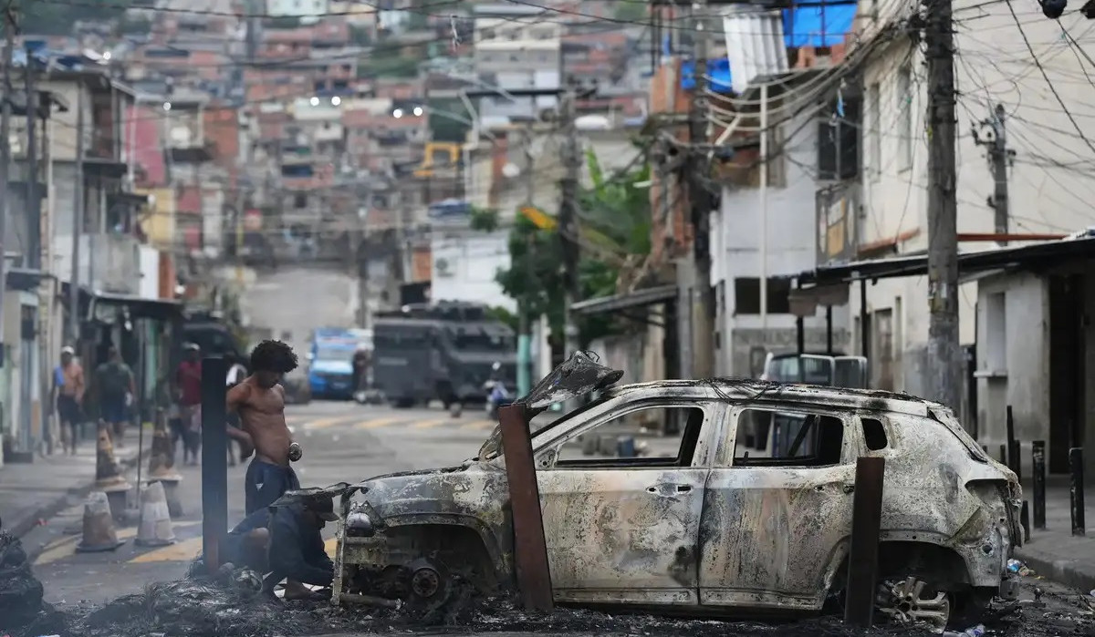 At least 64 killed in Rio police raids ahead of climate conferences