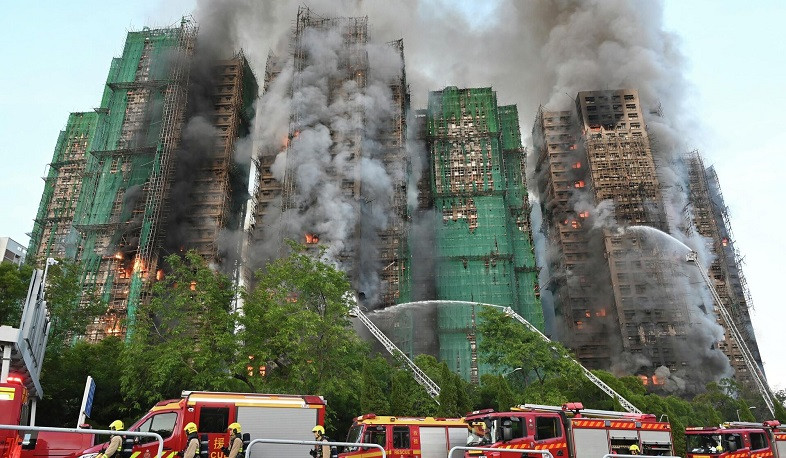 Eight more arrested over deadly Hong Kong blaze as toll rises to 128 with hundreds still missing