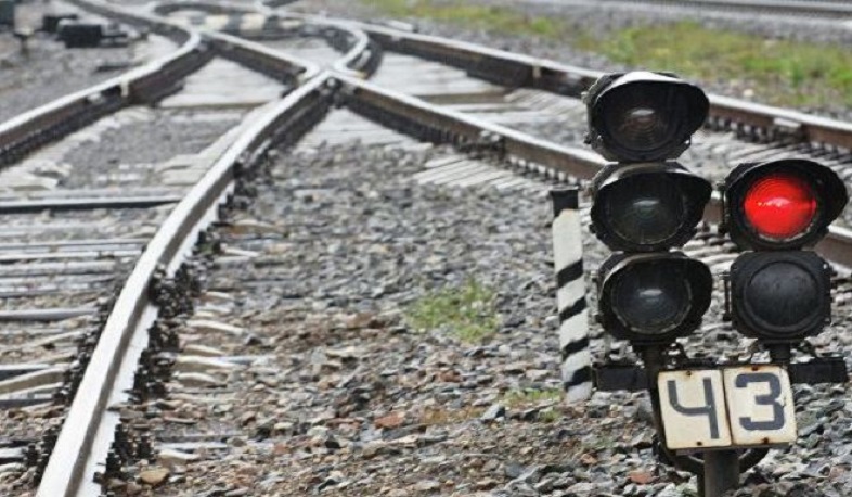 Two people wounded in train and car collision